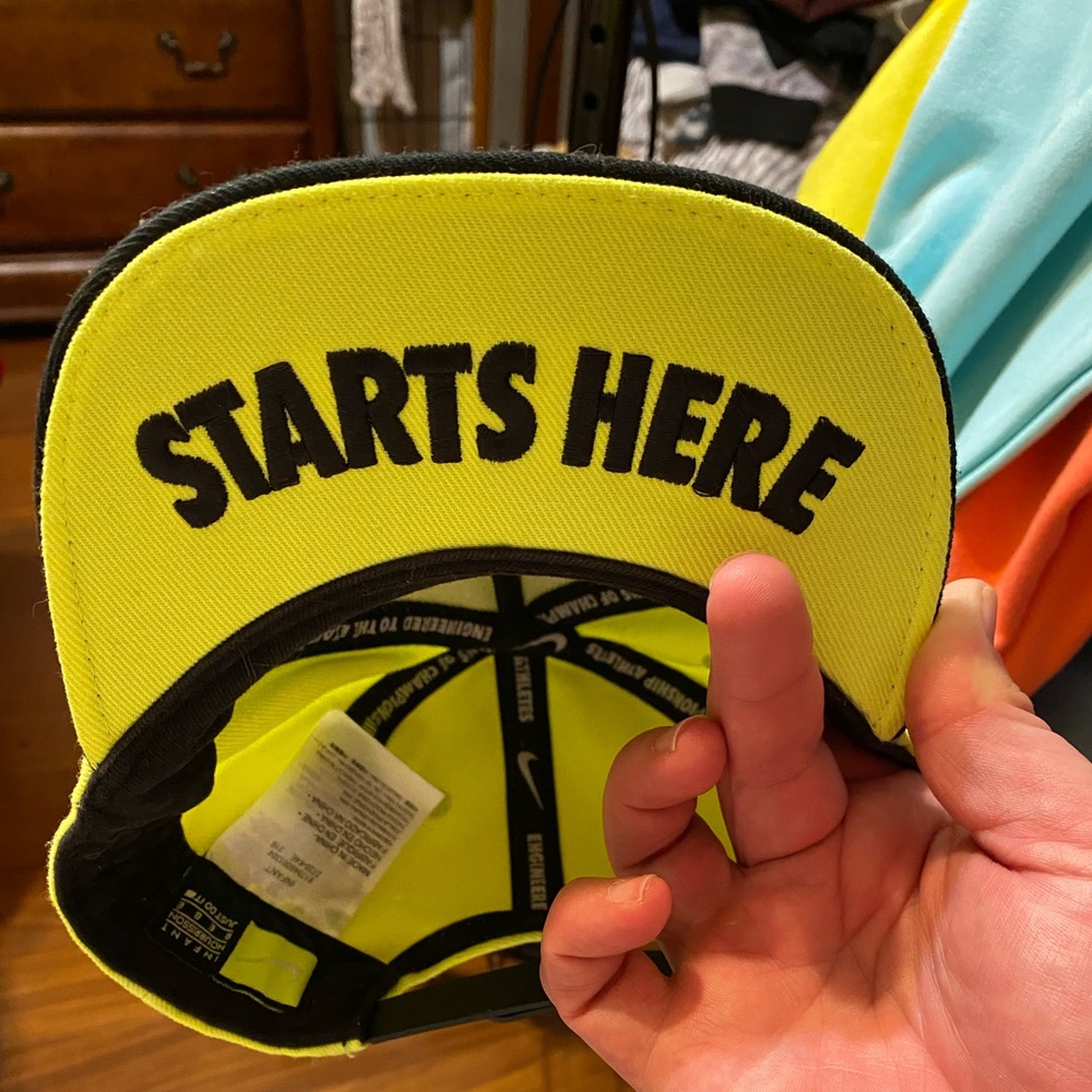 Bright yellow Nike infant snap back